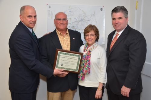 Pictured [l to r] are EDC chairman Perry Maresca, Munger Construction president David DeMaio, and vice president Pam DeMaio, and First Selectman Jamie Cosgrove.
